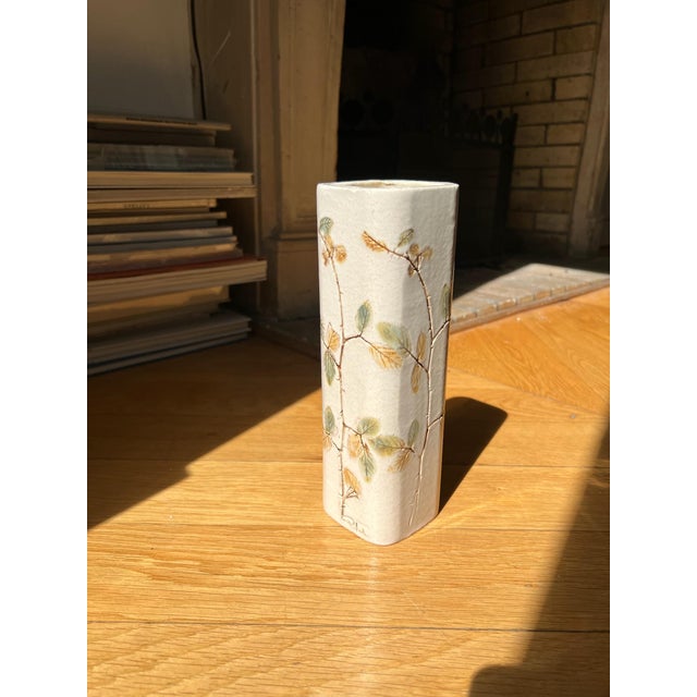 White ceramic "Herbarium" vase by Raymonde Leduc, Vallauris, 1960s. This beige and white ceramic piece features a stylized...