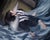 Night Swim by Nadezda | Oil on panel Woman floating in water wearing a black outfit. For Sale