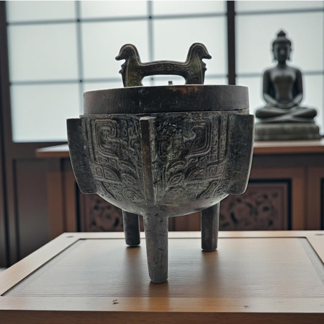 A substantial late twentieth-century Chinese archaistic tripod incense burner or censer, conceived in the traditional form...