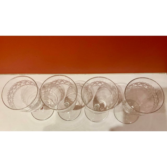 Spruce up your dinner setting by adding vintage charm to your drinkware collection with this elegant 4-piece set of water...