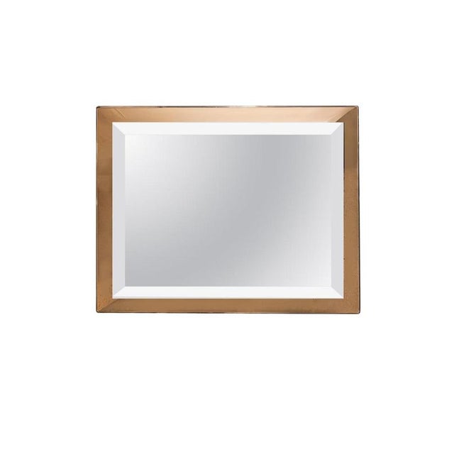 Elegant Italian rectangular wall mirror dating from the 1960s, featuring a sophisticated two-tone mirrored composition....