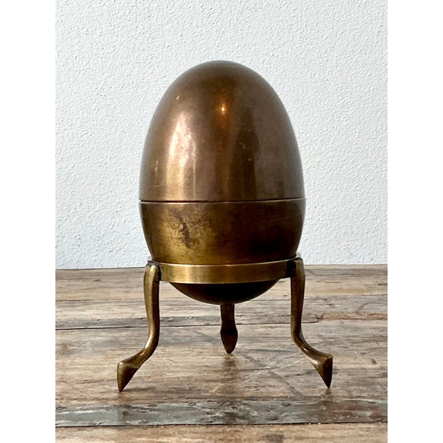 This striking vintage trinket box captures the essence of Hollywood Regency glamour with its sculptural, ovoid form. Cast...