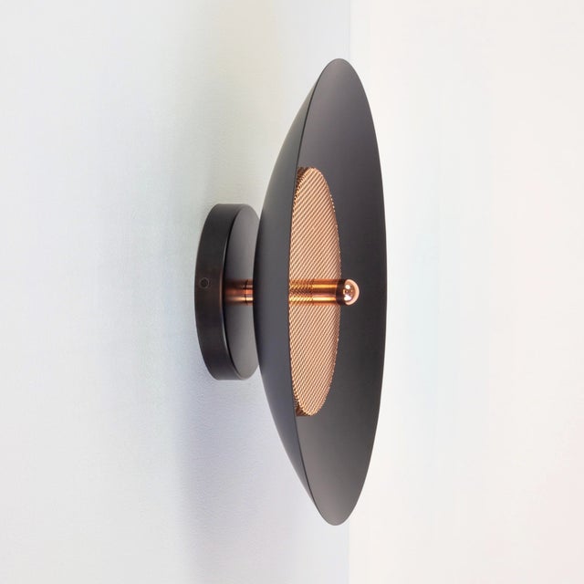 This listing is for 1x Signal Sconce with a black shade and copper accents from Souda (as shown in the main image). It can...