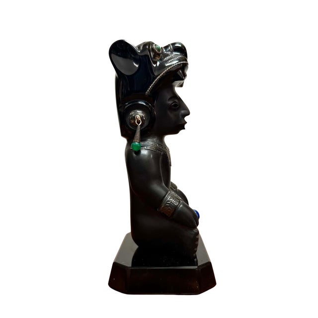 This striking vintage Mexican sculpture is hand carved from polished black obsidian and adorned with sterling silver...