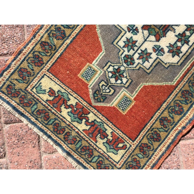 This gorgeous hand knotted Vintage Anatolian area rug is approximately 60 years old in excellent vintage condition. The...