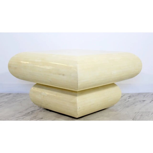 Tessellated stone, square coffee table in the style of Karl Springer. In excellent condition. The dimensions are 26.5" Sq...