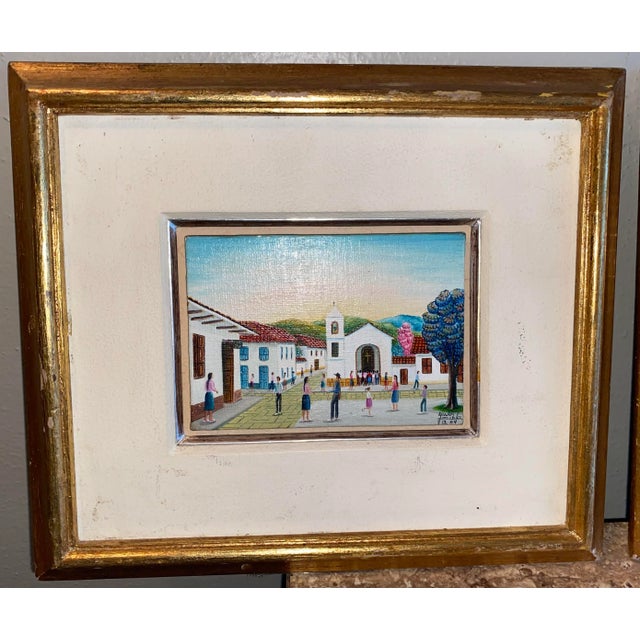 A fabulous pair of vintage Mexican paintings. Oils on board, each measures just 3” x 4”. Mounted atop mat, framed...
