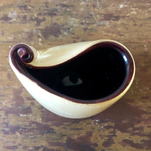 Small violet and gold cased Murano glass vase.