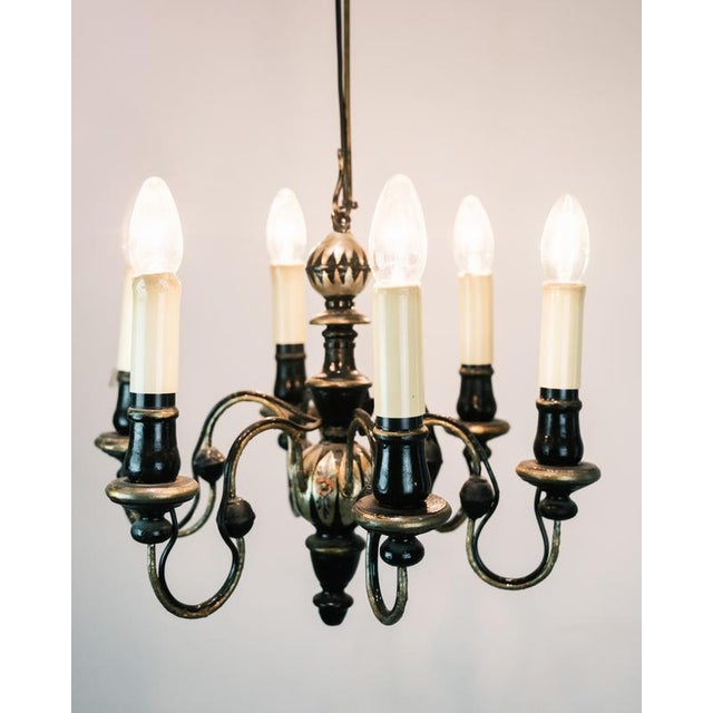 Church crown with 6 arms, made of wood and decorated with gold, from the 1930s. This chandelier combines classic...