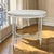 This elegant French Louis XVI style center table features a beautifully balanced oval form with a painted finish that...