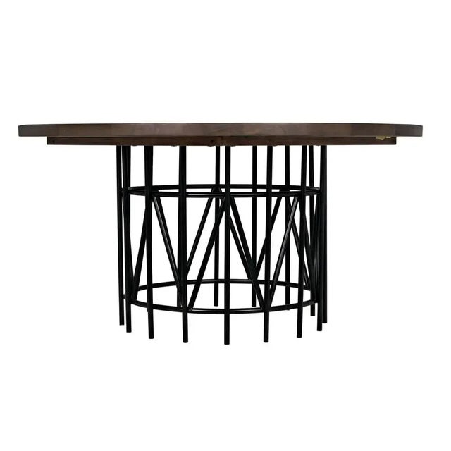 This generously sized dining table has been hand-carved of solid walnut and enhanced with a hand-rubbed dark walnut...