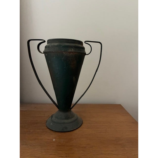 A pair of very unusual florist's urns with sculptural form and handles in metal Aged patina Circa 1920
