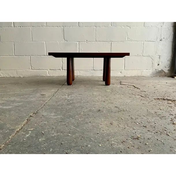 A lovely handmade low table in turned and laminated American Black Walnut, featuring visible joinery, tapered and rounded...