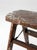 An early 20th-century wooden step ladder stool featuring a simple, well-balanced silhouette and timeless rustic appeal....