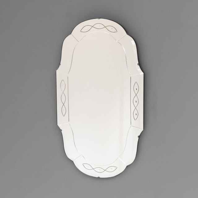 Art deco style frameless wall mirror. U.K circa 1950.