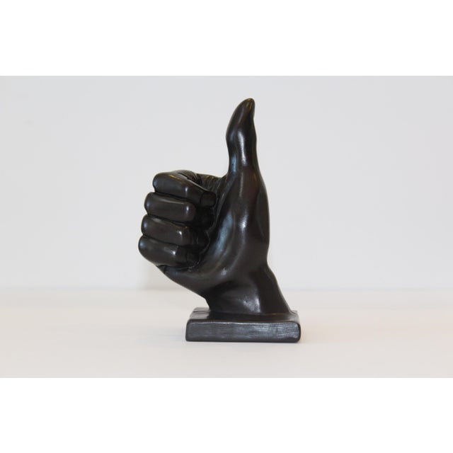 As an eye catching accent, this “Thumbs Up” hand symbol sculpture is sure to bring an uplifting and stylish vibe to any...