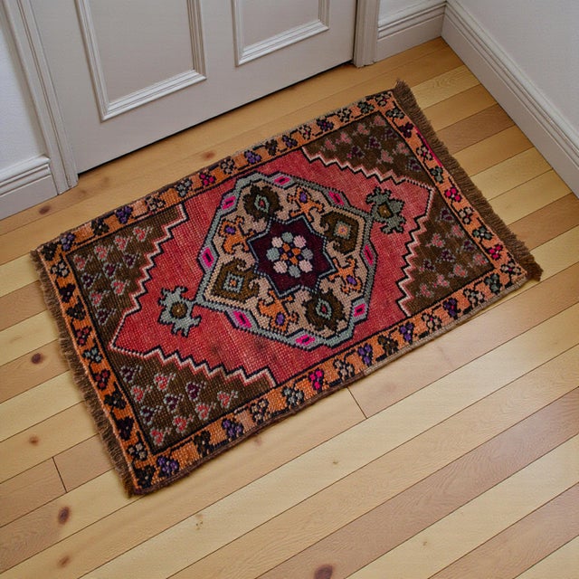a Vintage deep red background color small rug perfect for a small guest bath or in front of the kitchen sink Dimensions:...