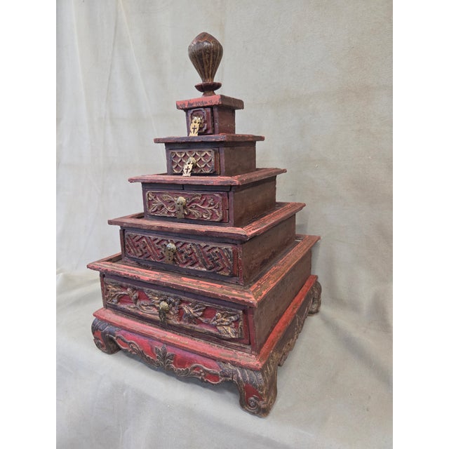 A beautiful vintage mid to late 20th century pyramid shaped jewelry box with five drawers from South Sumatra, Palembang,...