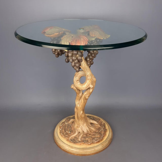 Wonderful vintage Mid-Century round coffee table, made in the shape of a grape vine with bunches of grapes, made of carved...