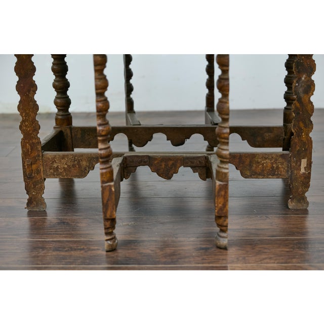 A Spanish gateleg drop leaf table from the 18th century with original painted floral polychrome décor. This 18th-century...