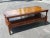 A well kept 1958 Hollywood Regency Mahogany and Tooled Leather Top and Gilt Stencil Two tier Coffee Table on original...