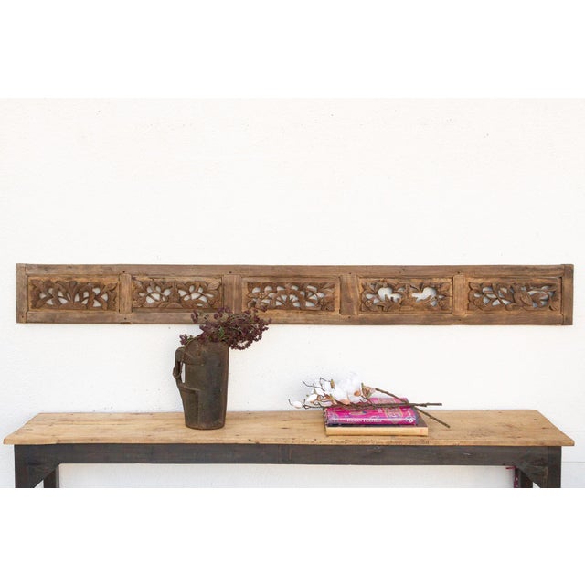Invite a piece of profound history and breathtaking artistry into your home with this magnificent antique, finely carved...