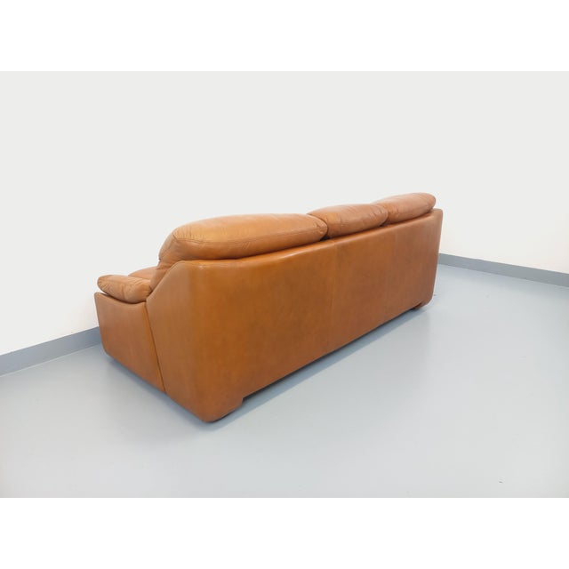 Vintage 1970s sofa, superb design in the style of De Sede or Ligne Roset, in cognac or camel leather, 3-seater, firm yet...