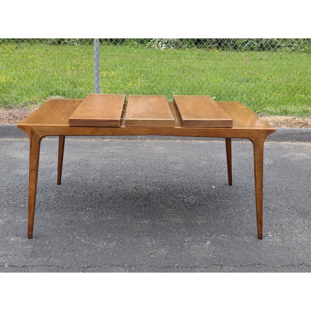 Elevate your dining space with this rare, expertly crafted mid-century modern architectural masterpiece. Designed by...