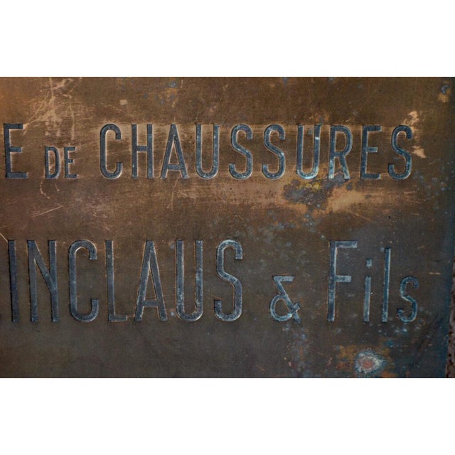 This old copper plaque announced a shoe factory. Patinated and full of character, this plaque makes an original wall...