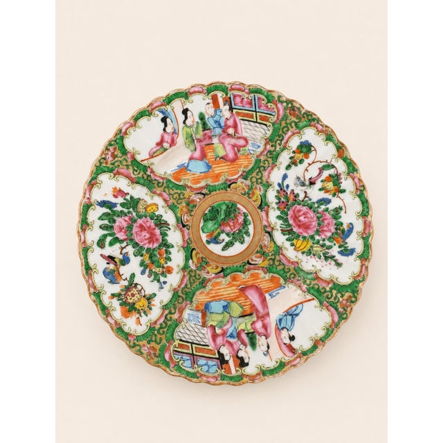 A beautiful set of four Chinese Rose Medallion porcelain plates, distinguished by their wonderfully scalloped rims and...