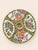A beautiful set of four Chinese Rose Medallion porcelain plates, distinguished by their wonderfully scalloped rims and...