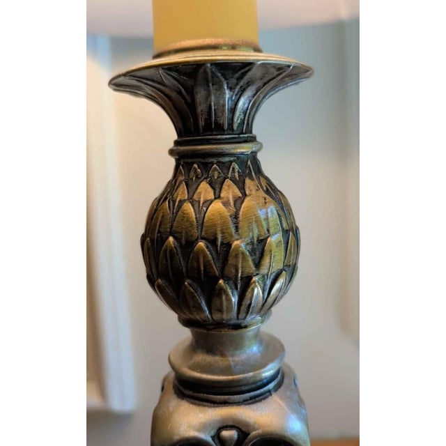 Elegant traditional table lamp pair featuring substantial heavy cast metal bases with classic neoclassical detailing and...