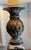 Elegant traditional table lamp pair featuring substantial heavy cast metal bases with classic neoclassical detailing and...