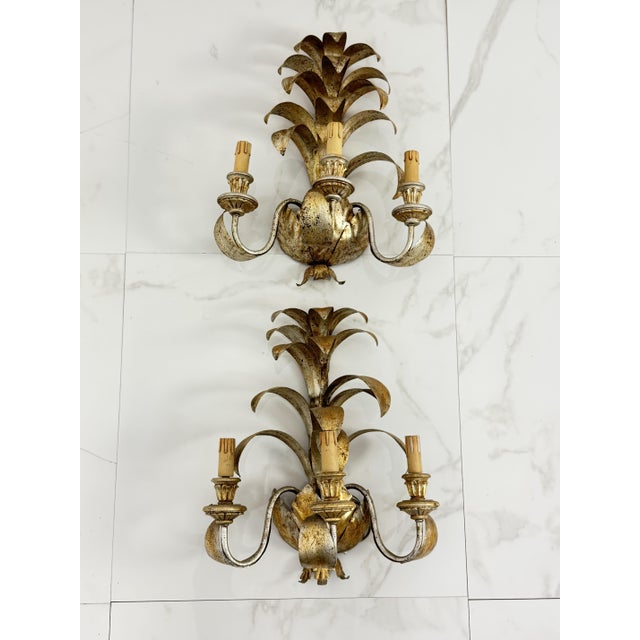Set of two large Hollywood Regency-style wrought iron wall lamps, 1980s Silver with gold accents. Intact and in good...