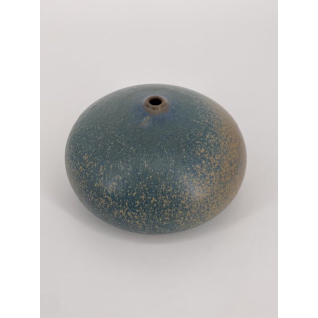 a vase * Manufacturer: handmade * Shape: Vase * Color: Green, Turquoise * Material: ceramic, glazed * Origin: probably...