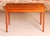 Danish Mid Century extending teak dining table, circa 1970s. Two pull-out extension leaves stored underneath. Extends to...