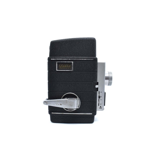 Capture a classic Hollywood aesthetic with this vintage Bell & Howell 8mm movie camera. Produced in the USA, this...