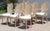An exceptional, highly coveted set of eight (8) vintage Italian Hollywood Regency Venetian grotto-style dining chairs...