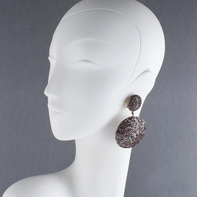 Fabrice, Paris designed these stunning clip-on earrings. Each piece is handmade, unique, and expertly crafted by Cilea...