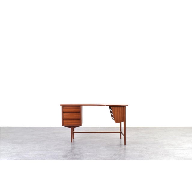 This teak desk was manufactured in Denmark in the 1960s. The desk has been professionally and carefully restored by...