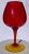 Large sized red whine glass. Circular base with yellow finish.