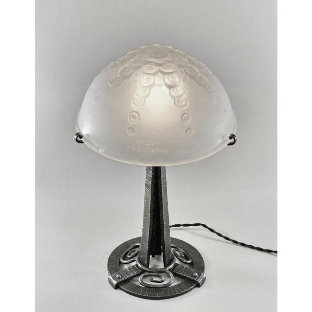 Muller frères A wonderful French 1930 art deco lamp in wrought iron. The forged base holds a large shade by Muller frères...