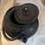This Japanese teapot, specifically a Nambu Tekki (Nanbu Ironware) cast iron tetsubin tea kettle, was authentically crafted...