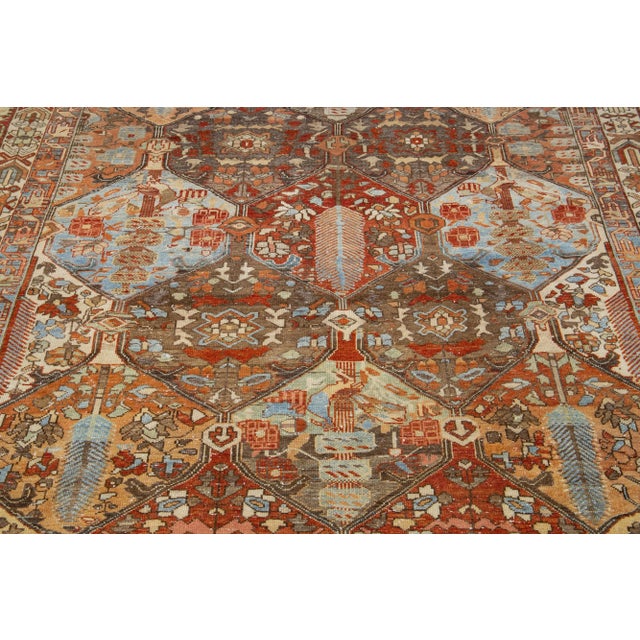 Beautiful Antique Bakhtiari hand-knotted wool rug with a gray color field. This Persian piece has a classic geometric...