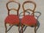 Set of two Louis Philippe style chairs, 19th century. Solid walnut frame. Curved front legs, saber-shaped back. Curved and...