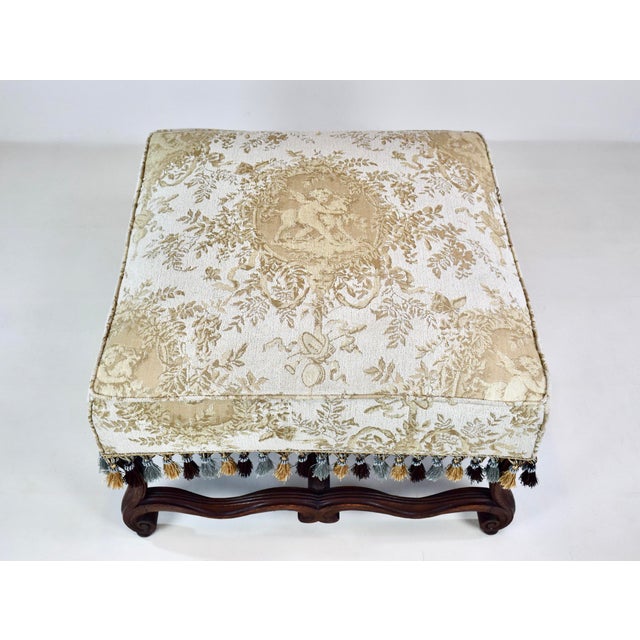 An unusually grand Os de Mouton early 19th Century ottoman with sinuous, winding curved legs and stretchers traditionally...