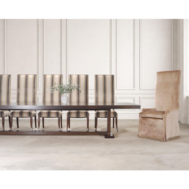A monumental bespoke walnut trestle dining table designed by Marshall Watson for Ferrell + Mittman in High Point, North...