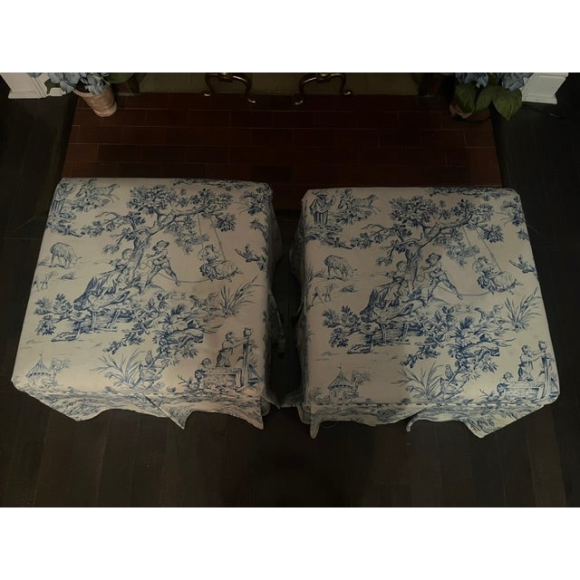 Two matching blue and white toile ottomans. We used them for extra seating first in our living room (they looked great...
