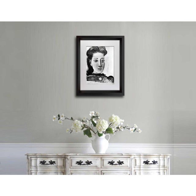 Pablo Picasso (1881-1973) Limited Edition Lithograph A compelling limited edition lithograph by Pablo Picasso featuring an...