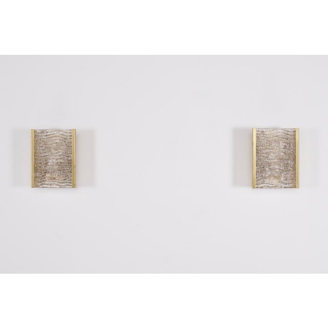 Pair of italian wall sconces in gilt metal and murano glass, dating from the 1960s/1970s. in perfect condition, they were...